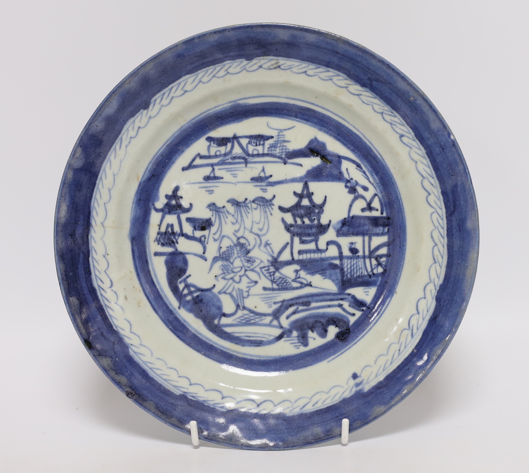 Two Chinese blue and white plates and a similar shallow bowl, largest 26cm high